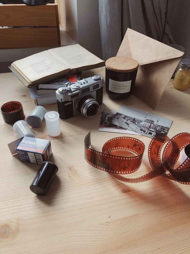 camera and roll films, prints and negatives