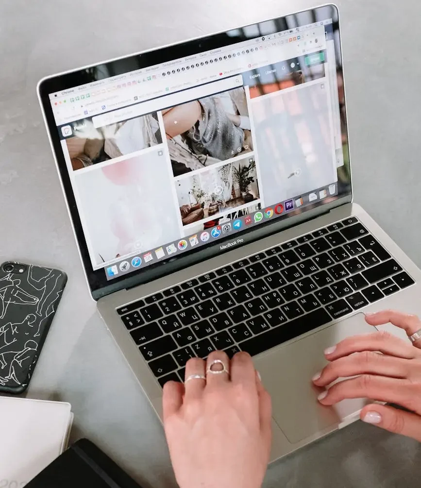 person using macbook pro on table, digital photo organization, ongoing organization services, arranged memories, photo organization services, waukesha county, washington county, ozaukee county, Wisconsin