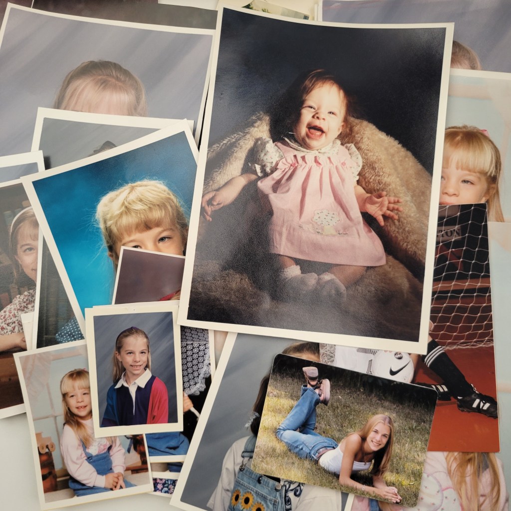Pile of school photos of a child , arranged memories, printed photo organization, scan and enhance, convert vhs to digital, ongoing organization, washington county, waukesha county, ozaukee county, wisconsin
